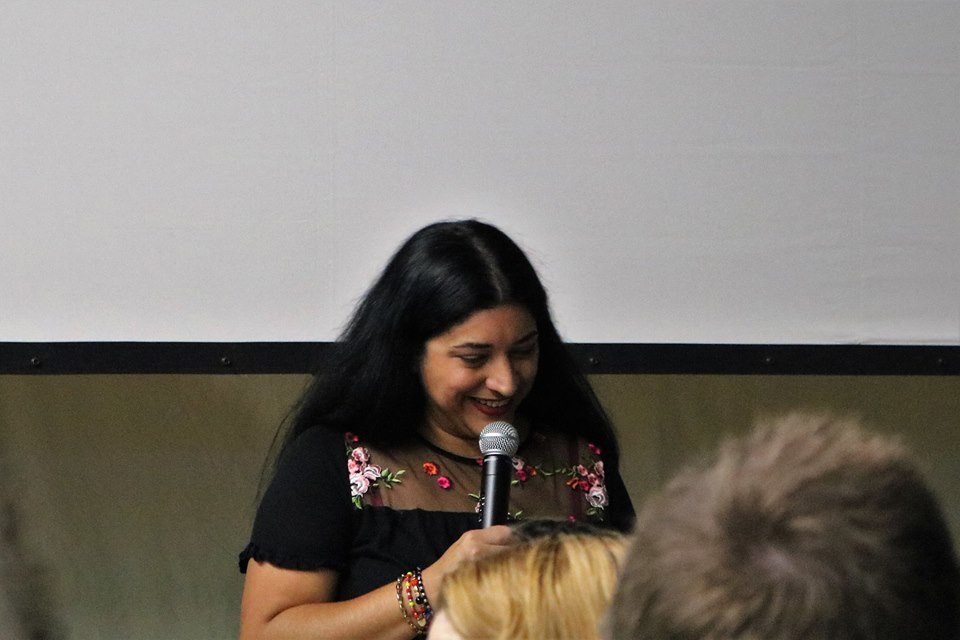 Lorena speaking at an event